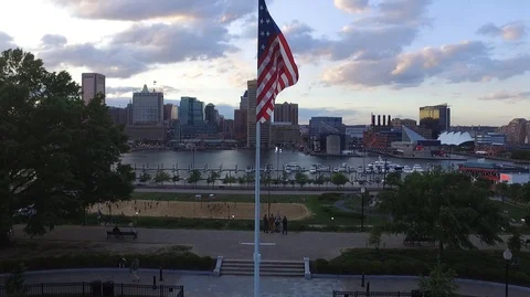 Flag Waving Aerial over Baltimore Inner Harbor - Federal Hill 動画素材 90306751