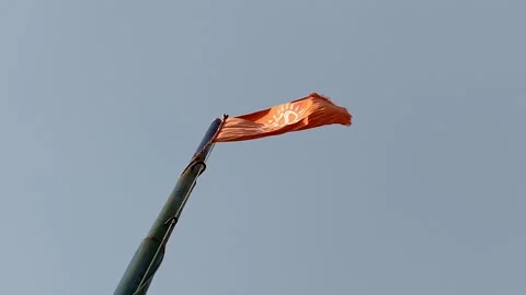 Flag waving against clean blue sky, close up Stock-Footage 164873686