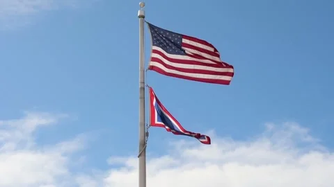 A flag waving along the town of Cheyenne, Wyoming Stock Footage 209735564