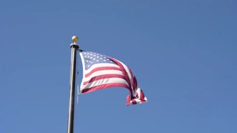 A flag waving along the town of Tucson, Arizona Stock Footage 209735511
