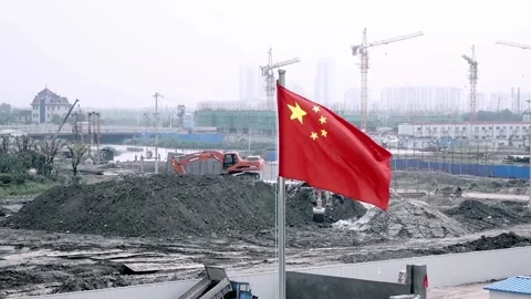 Flag waving at construction site Stock Footage 235133187