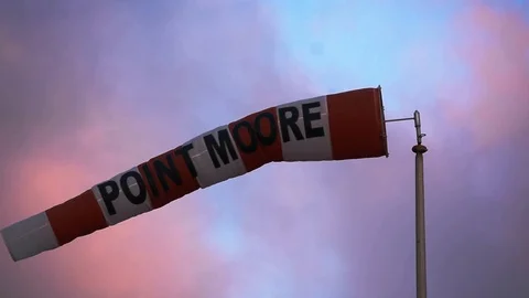Flag Waving in Front of Sunset Stock Footage 99964875