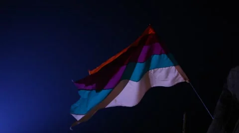 Flag waving lite at night wind Stock Footage 45531398