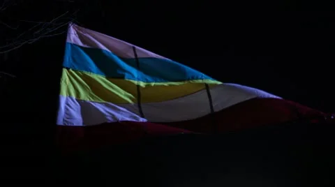 Flag waving lite at night wind Stock Footage 45531412