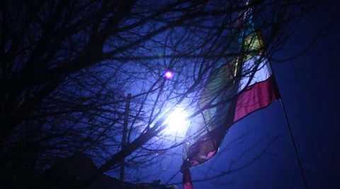 Flag waving lite at night wind Stock Footage 45590415