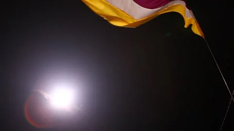 Flag waving lite at night wind Stock Footage 45590724