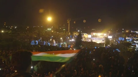 Flag waving over crowd Kurdish Newroz Stock Footage 81800046