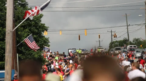 Flag Waving Over Parade Spectators Stock Footage 26113772
