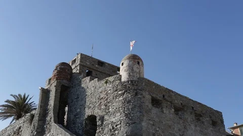 Flag waving on the sentry box of an ancient castle 02 Stock Footage 109016534