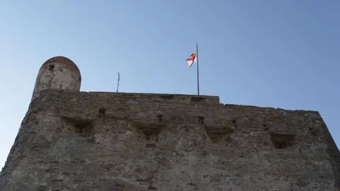 Flag waving on the sentry box of an ancient castle 03 Stock Footage 109017461
