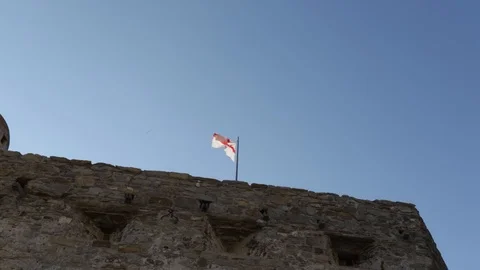 Flag waving on the sentry box of an ancient castle 05 Stock Footage 109018298