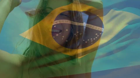 Flag waving sparking fade into model lifting arms fixing hair smiling draping Stock Footage 334311545