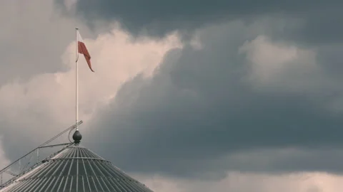 The flag waving in the wind on the top of the polish parliament Stock Footage 124877128