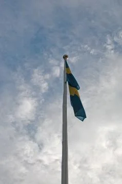 Flagpole with Swedish flag Stock Photos