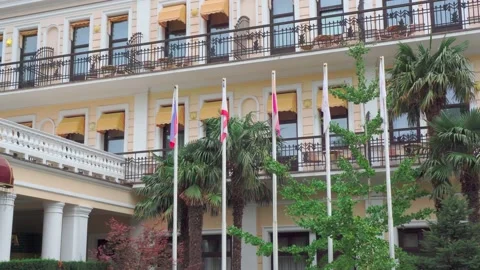 Flagpoles on the background of the building Stock Footage 143804311