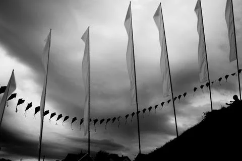 Flags against a storm background Stock Photos