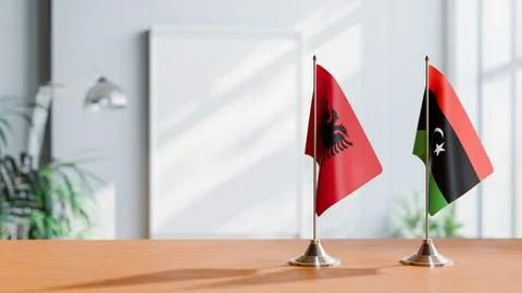 FLAGS OF ALBANIA AND LIBYA ON TABLE Stock Photos