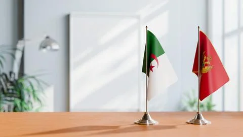 FLAGS OF ALGERIA AND MONTENEGRO ON TABLE Stock Photos