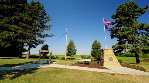 Flags and the monument at the geographic center park Stock-Footage 345530869