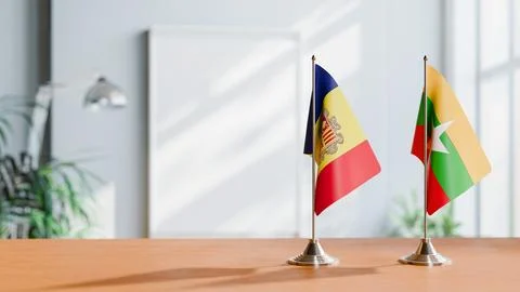 FLAGS OF  ANDORRA AND MYANMAR  ON TABLE Stock Photos
