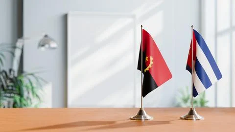 FLAGS OF  ANGOLA AND CUBA  ON TABLE Stock Photos