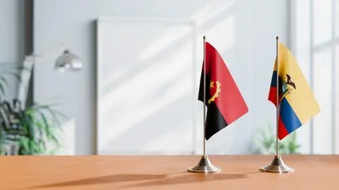 FLAGS OF  ANGOLA AND ECUADOR  ON TABLE Stock Photos