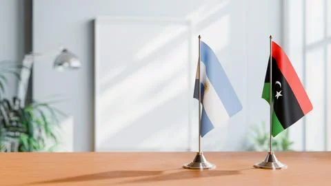 FLAGS OF  ARGENTINA AND LIBYA  ON TABLE Stock Photos