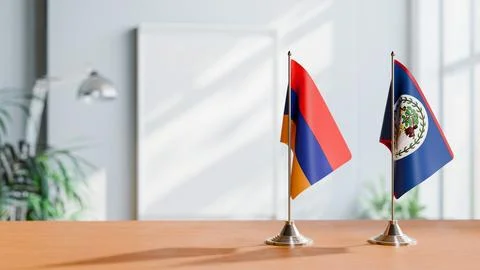FLAGS OF  ARMENIA AND BELIZE  ON TABLE Stock Photos