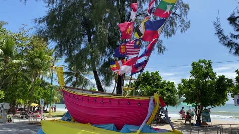 Flags of Asian countries are seen in Patong beach, Phuket island, Thailand 4K Stock Footage 194647720