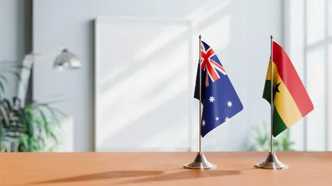 FLAGS OF  AUSTRALIA AND GHANA  ON TABLE Stock Photos