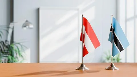 FLAGS OF  AUSTRIA AND BOTSWANA  ON TABLE Stock Photos