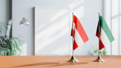FLAGS OF  AUSTRIA AND KUWAIT  ON TABLE Stock Photos