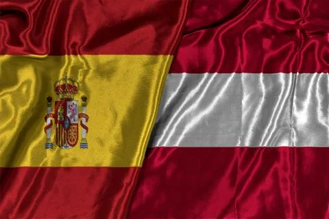 Flags of AUSTRIA and SPAIN with realistic cloth texture Stock Photos