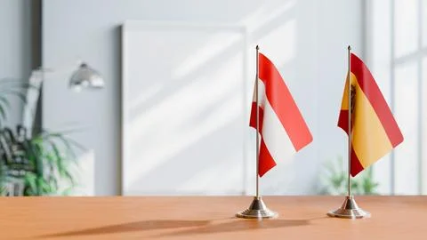 FLAGS OF  AUSTRIA AND SPAIN  ON TABLE Stock Photos