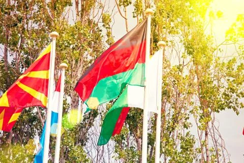 Flags  on the background of the blue sky in the sunlight Stock Photos