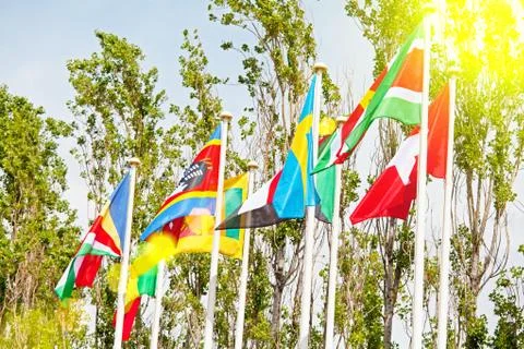 Flags  on the background of the blue sky in the sunlight Stock Photos