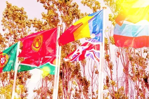 Flags  on the background of the blue sky in the sunlight Stock Photos