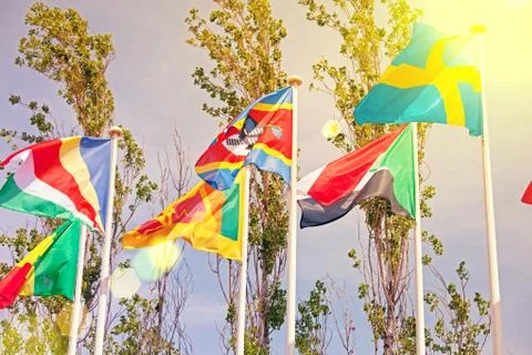 Flags  on the background of the blue sky in the sunlight Stock Photos