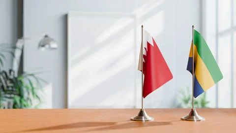 FLAGS OF  BAHRAIN AND GABON  ON TABLE Stock Photos