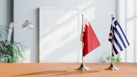 FLAGS OF  BAHRAIN AND GREECE  ON TABLE Stock Photos