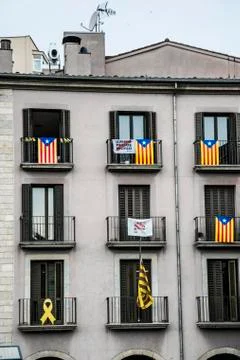 Flags on the balconies of a building Stock Photos