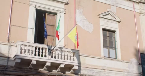 Flags on the balcony of a building in Palermo, Sicily, Italy, 4k Stock Footage 332717585