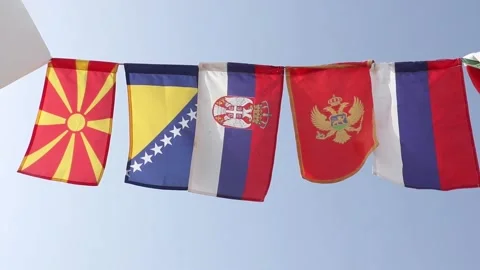 Flags of Balkan Countries And Russia Swaying Together Against The Blue Sky Video stock 158402873