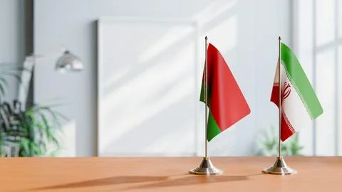 FLAGS OF  BELARUS AND IRAN  ON TABLE Stock Photos