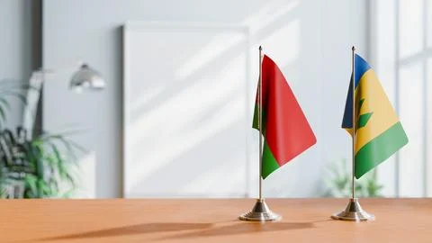 FLAGS OF  BELARUS AND SAINT VINCENT  ON TABLE Stock Photos