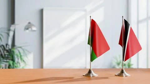 FLAGS OF  BELARUS AND TRINIDAD  ON TABLE Stock Photos