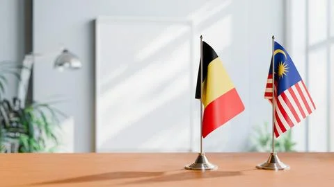 FLAGS OF  BELGIUM AND MALAYSIA  ON TABLE Stock Photos
