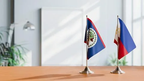 FLAGS OF BELIZE AND PHILIPPINES ON TABLE Stock Photos