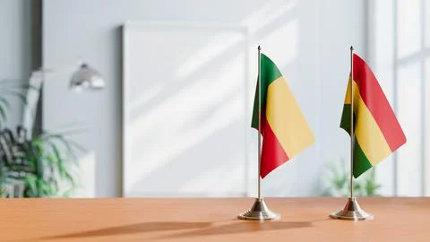 FLAGS OF BENIN AND BOLIVIA ON TABLE Stock Photos