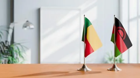 FLAGS OF BENIN AND MALAWI ON TABLE Stock Photos